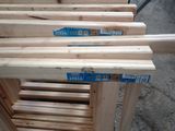 several pieces of wood are stacked on top of each other