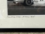 a black and white photo of a race car