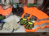 a table with a lot of gloves, gloves, and other items