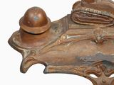 a small metal object with a hat on it