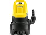 un aspirateur jaune et noir muni d'un tuyau