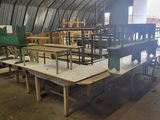 many tables and chairs that are in a room