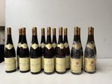 several bottles of wine are lined up on a table