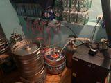 two kegs that are sitting on the floor next to each other
