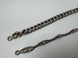 pair of antique silver plated chain bracelets on a white background