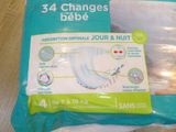 a bag of diapers sitting on a table with a label on it