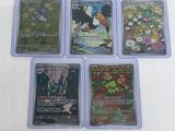 four different types of pokemon cards on a white surface