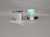 two cups that are sitting next to each other on a table