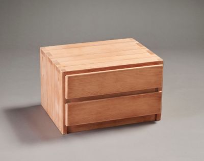 a small wooden box with two drawers on it
