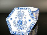 a blue and white octagonal shaped box on a table