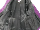a close up of a black cape with purple trim on a white background