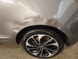 a close up of a car that has been dented