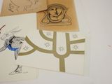 many cards with drawings of animals on them on a table