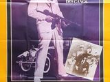 an old movie poster of a man in a white suit and hat holding a gun