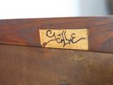 a close up of a wooden box with a label on it