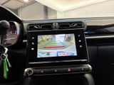 a picture of a car dashboard with a gps device in it