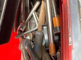 a lot of tools that are in the back of a truck