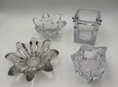 three pieces of glass sitting on a white surface