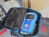 a suitcase with a cell phone inside of it