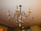a chandelier hanging from the ceiling in a room