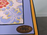 a close up of a table with a picture of a flower on it