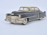 a toy car that is sitting on a white surface