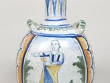 un vase bleu et blanc avec l'image d'un homme dessus