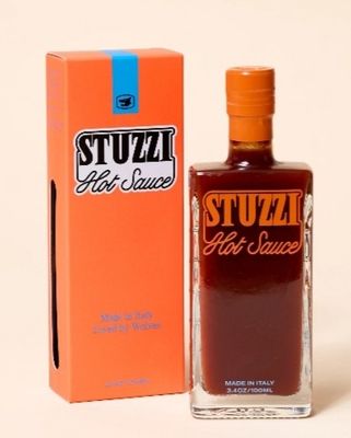 a bottle of stuff sitting next to a box of stuff