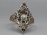 a close up of a ring with a stone in it