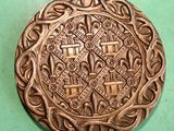 a metal object that is sitting on a green surface