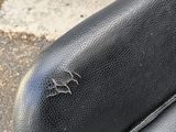 a close up of a black leather seat on a motorcycle