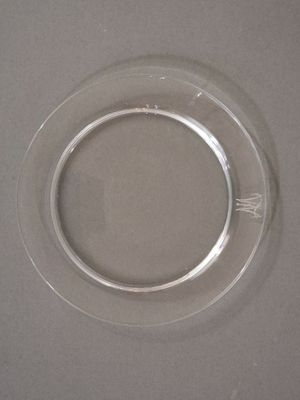 a clear glass plate with a circular design on it