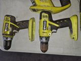 two electric tools that are sitting on a table