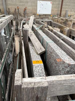 a large pile of granite blocks in a building