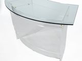a clear glass table with a curved glass top