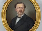 portrait of a man in a black suit and white shirt