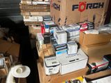many boxes and packages on a table in a room