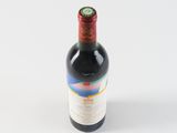 a bottle of wine that is sitting on a table