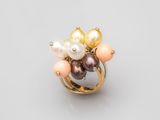 a gold ring with pearls and pearls