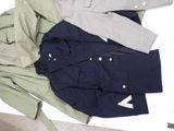 three jackets on a table next to each other