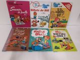 six livres pour enfants alignés sur une surface blanche