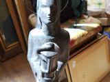 a statue of a woman holding a cup in her hands