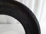 a close up of a tire on a white surface with a white background