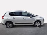 a picture of a small white car parked in a parking lot