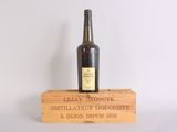 a bottle of wine sitting on top of a wooden box