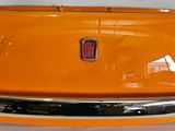 an orange car that is sitting on a table