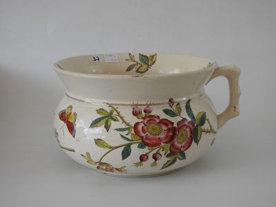 a white pitcher with a floral design on it