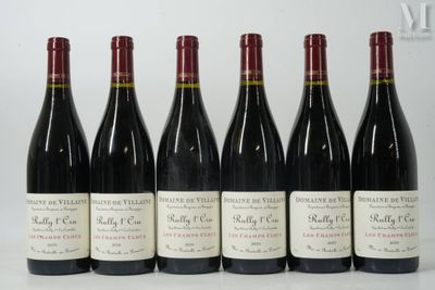 six bottles of wine are lined up in a row on a table