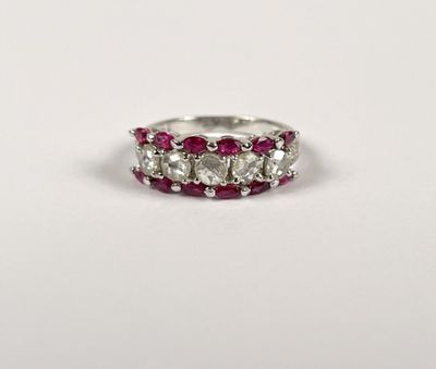 a close up of a ring with three stones on it