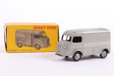 a toy truck that is sitting in front of a box